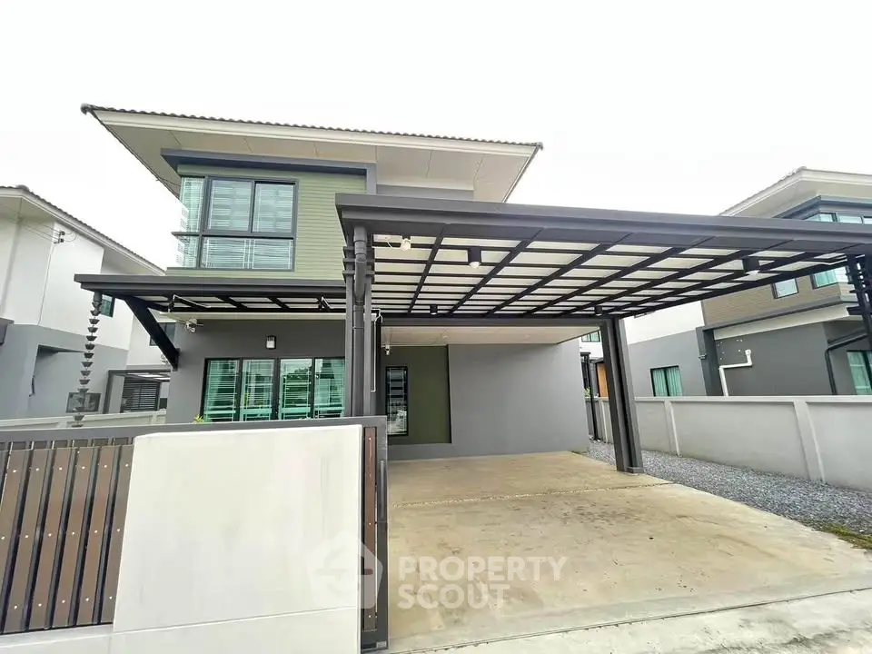 Modern two-story house with spacious carport and contemporary design