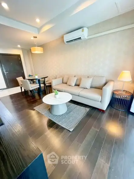 Modern living room with elegant decor and hardwood flooring