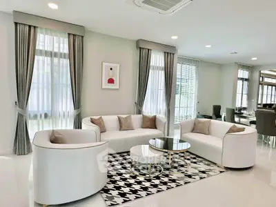 Luxurious modern living room with elegant white sofas and stylish decor