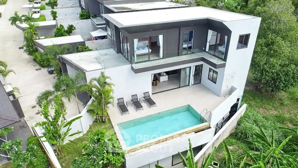 Luxurious modern villa with private pool and lush greenery, perfect for serene living.