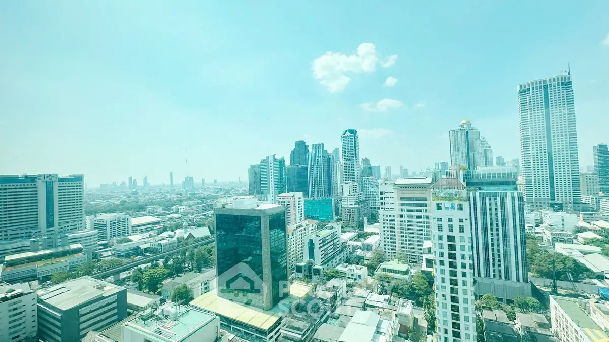 Stunning cityscape view of modern skyscrapers under a clear blue sky, showcasing urban living at its finest.