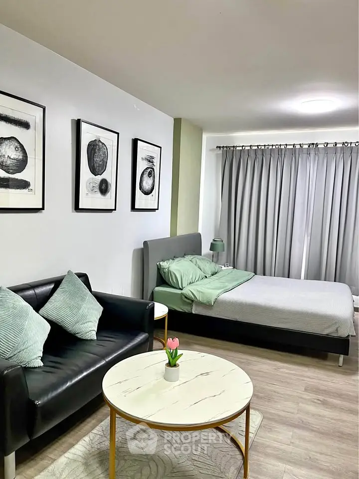 Modern studio apartment with cozy living area and stylish decor
