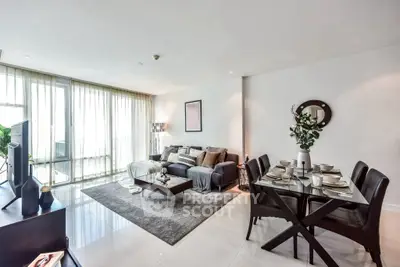 Spacious modern living room with elegant dining area and natural light