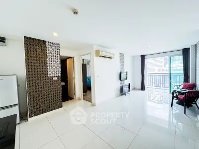 Spacious modern living room with balcony view in urban apartment