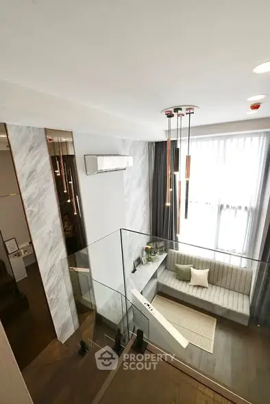 Modern duplex living room with stylish decor and natural light