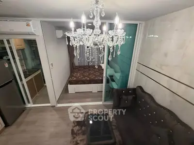 Luxurious living room with elegant chandelier and modern decor