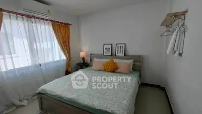 Cozy bedroom with natural light and stylish decor