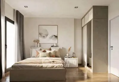 Elegant bedroom with modern decor, featuring a cozy bed, stylish artwork, and ample natural light.