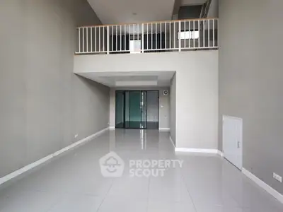 Spacious modern loft with high ceilings and mezzanine level, ideal for stylish urban living.