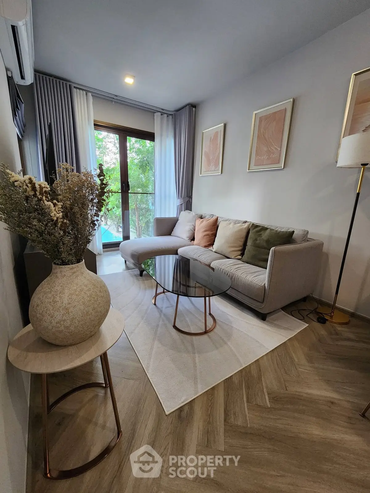 Stylish living room with modern decor and large windows for natural light.