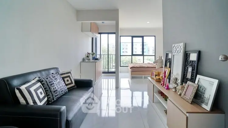 Modern apartment interior with sleek living room and bedroom view