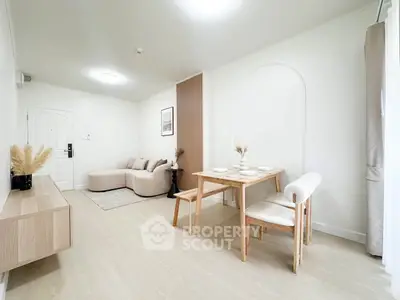 Modern minimalist living room with dining area, featuring neutral tones and stylish furniture.