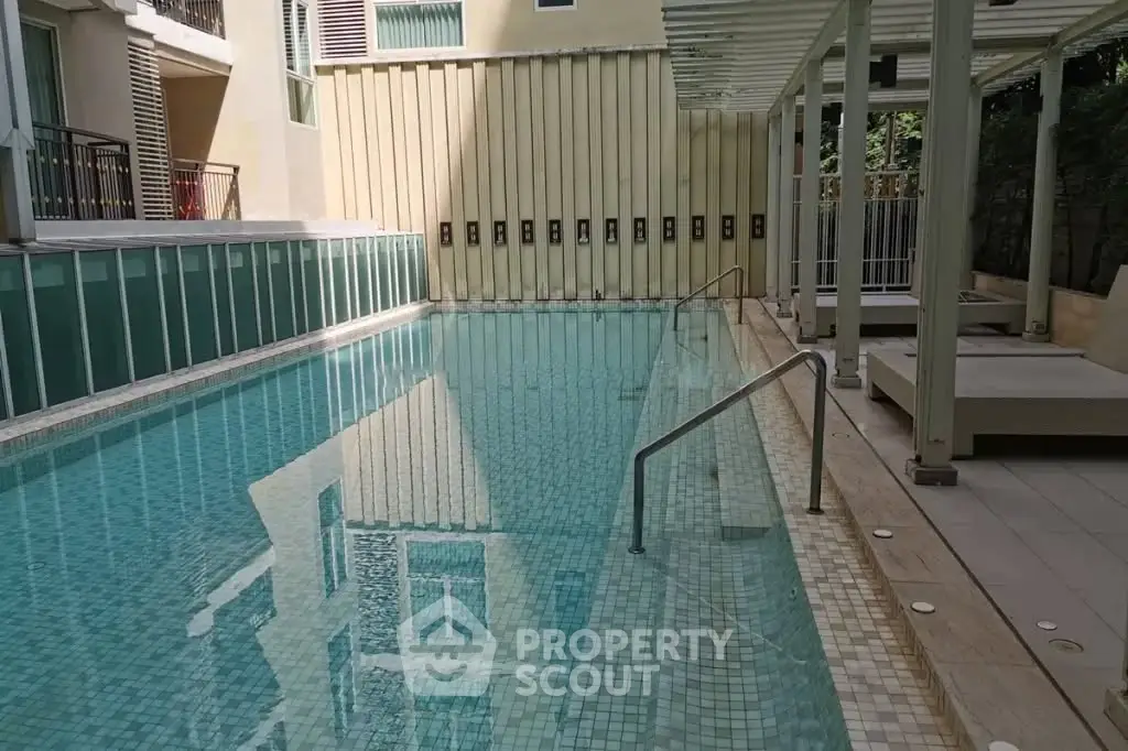 Luxurious residential pool area with modern design and serene ambiance