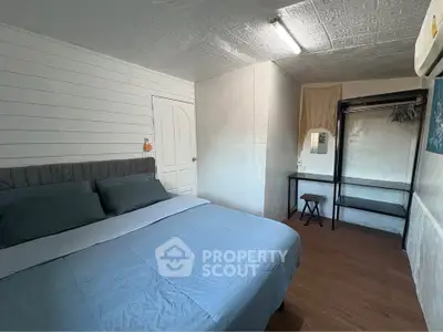 Cozy bedroom with modern decor and ample storage space