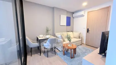 Modern living room with cozy seating and dining area in a stylish apartment.