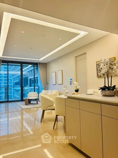 Luxurious modern living room with elegant decor and large windows offering stunning city views.
