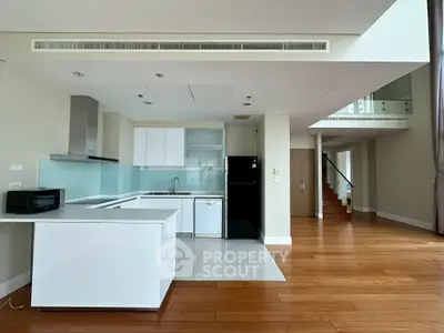 Spacious modern kitchen with open layout and sleek appliances in luxury home