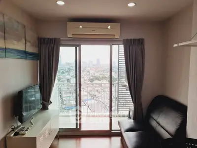 Modern living room with balcony and city view, featuring sleek furniture and air conditioning.