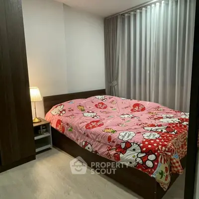Cozy bedroom with stylish decor and ample natural light