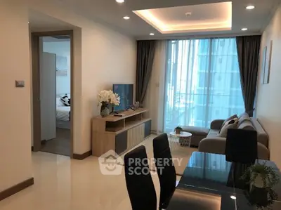 Modern living room with elegant decor and natural light in a stylish apartment.