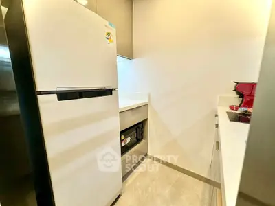 Modern kitchen with sleek appliances and minimalist design