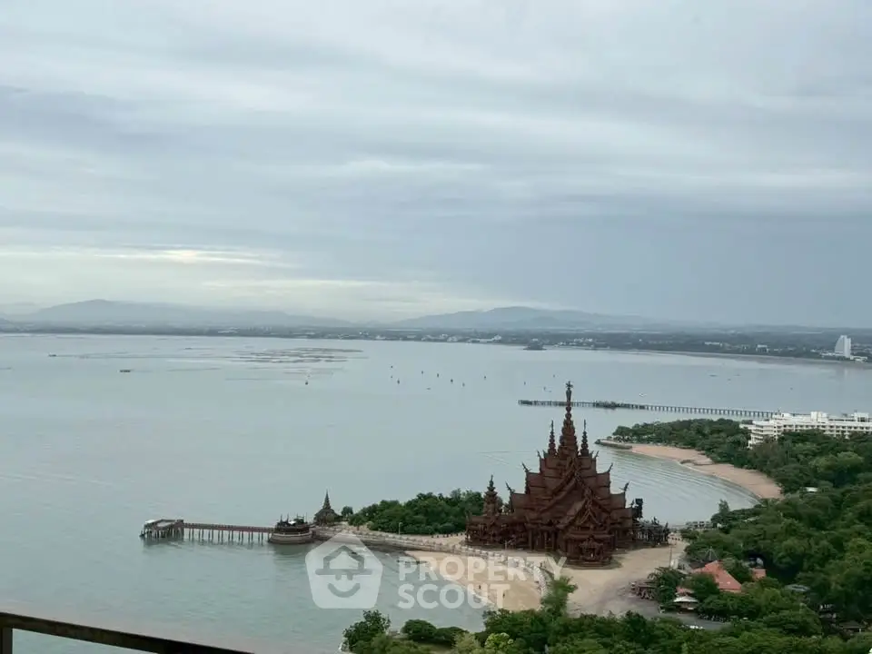 Stunning ocean view with iconic temple and lush greenery, perfect for serene living or vacation retreat.