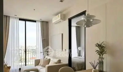Modern living room with elegant decor and large windows offering city views
