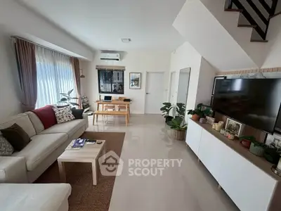 Spacious modern living room with elegant decor and natural light