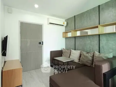 Modern living room with stylish decor and comfortable seating in a contemporary apartment.