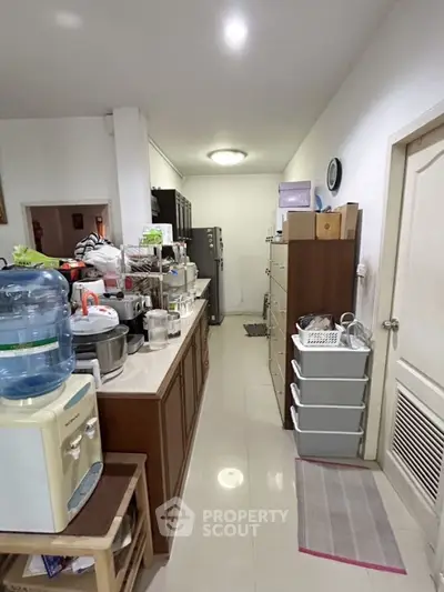 Spacious kitchen with modern appliances and ample storage space