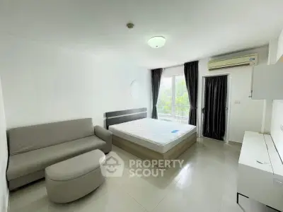 Spacious studio apartment with modern furnishings and natural light