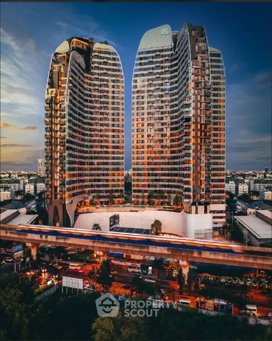 Stunning architectural marvel with modern high-rise design and vibrant cityscape view.