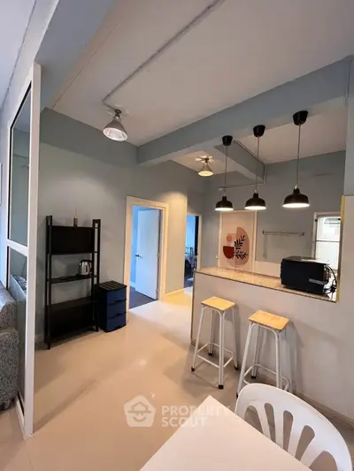 Modern kitchen with open layout and stylish bar stools