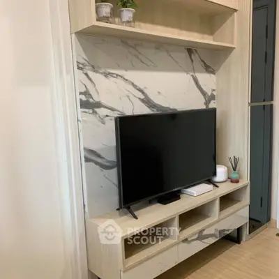 Modern living room with stylish TV stand and marble accent wall