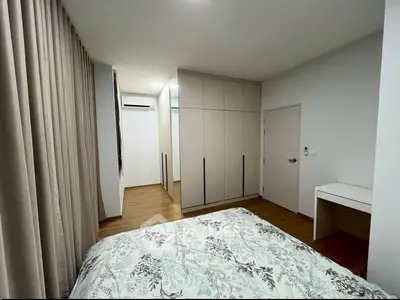 Modern bedroom with stylish decor and ample storage space