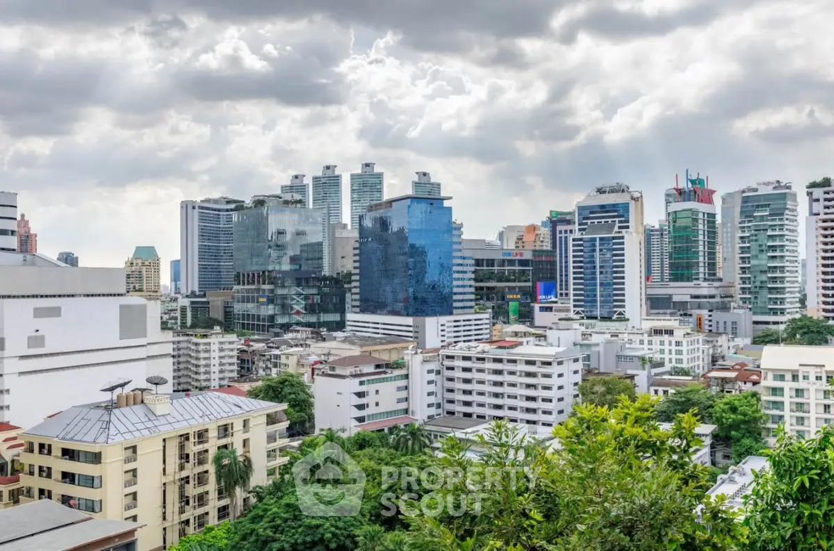 Stunning cityscape view showcasing modern skyscrapers and lush greenery, perfect for urban living enthusiasts.