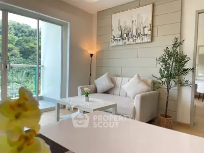 Stylish living room with modern decor and balcony view