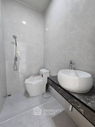 Modern bathroom with sleek fixtures and elegant marble countertop