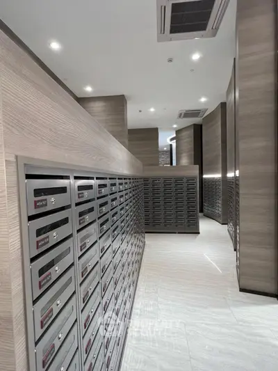 Modern apartment building mailroom with sleek design and ample mailboxes