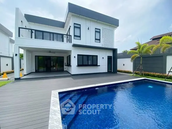Modern luxury home with private pool and spacious deck, perfect for relaxation and entertainment.