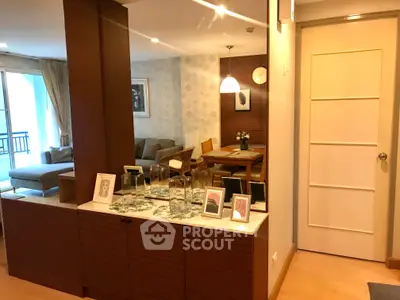 Stylish open-plan living and dining area with modern decor and ample natural light.