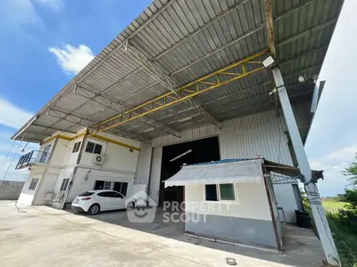 Spacious industrial warehouse with large open area and parking space.