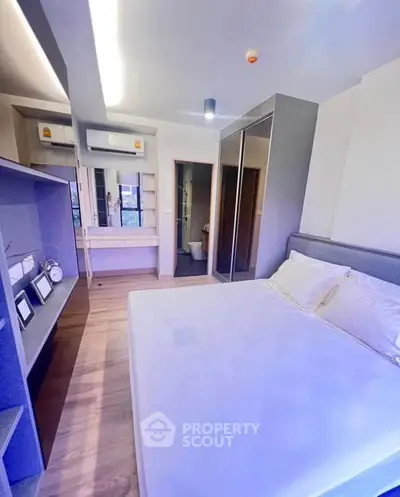 Modern bedroom with sleek design and ample storage space