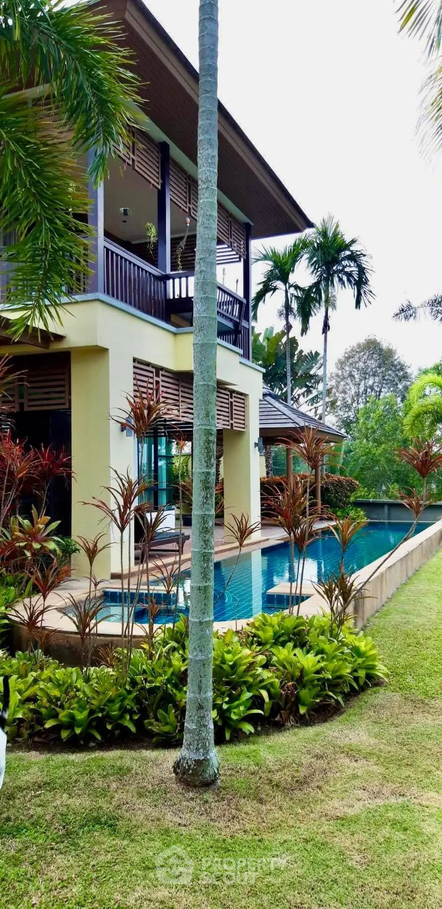 Luxurious tropical villa with private pool and lush garden, perfect for serene living.