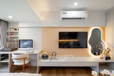 Modern living room with stylish decor and wall-mounted TV