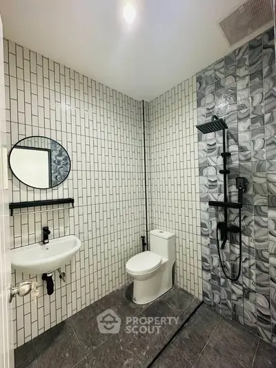 Modern bathroom with stylish tile design and sleek fixtures
