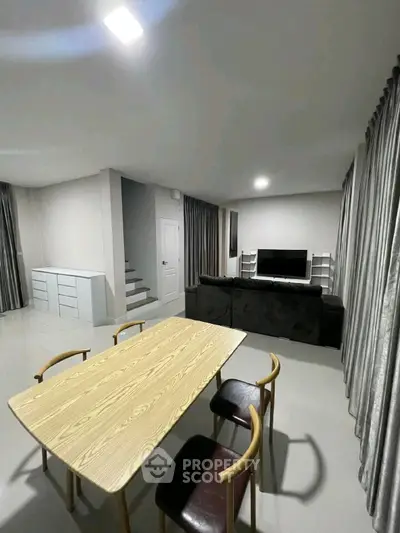 Modern living room with sleek furniture and open layout, perfect for contemporary living.