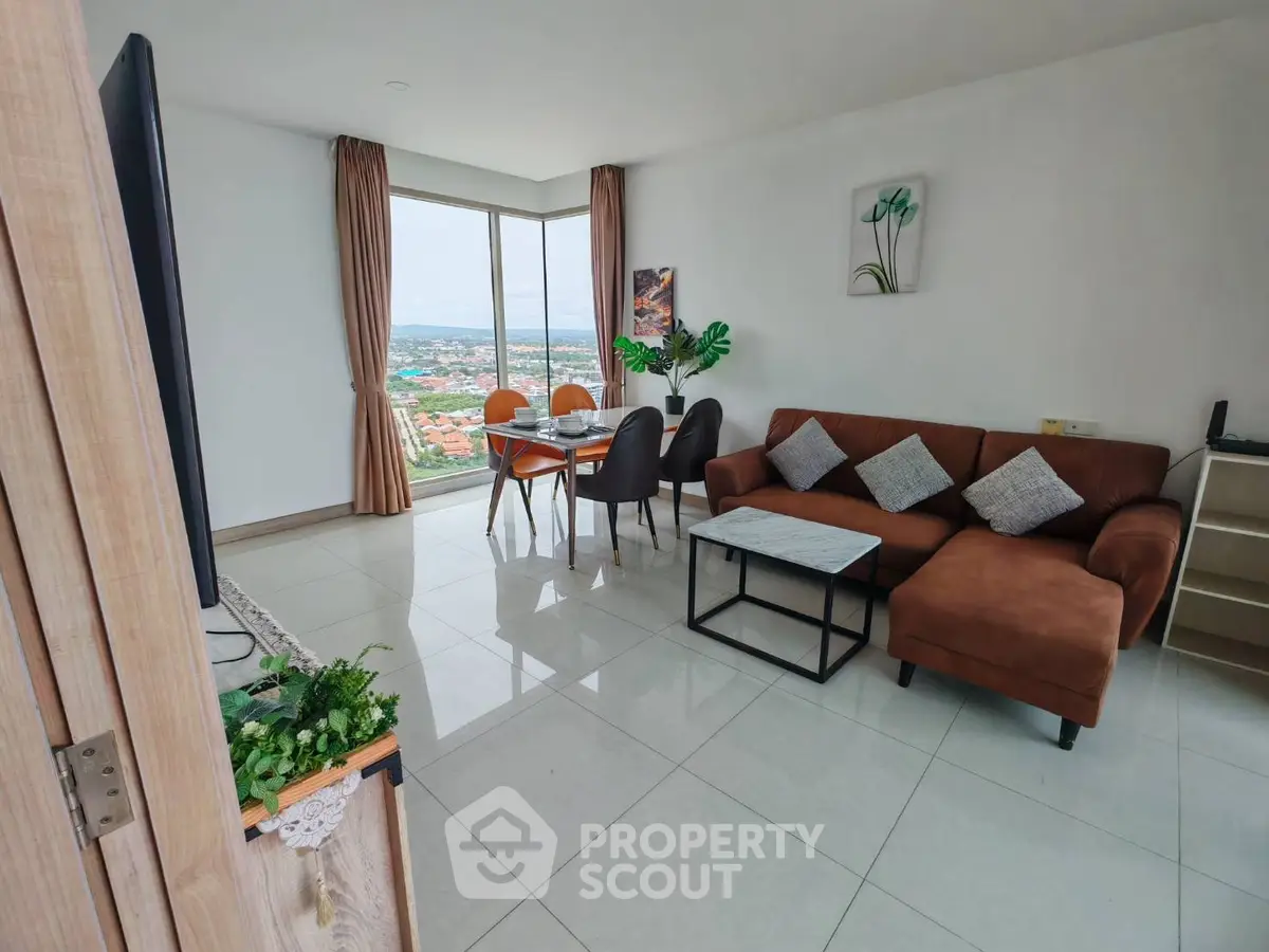 Spacious living room with panoramic view and modern furniture