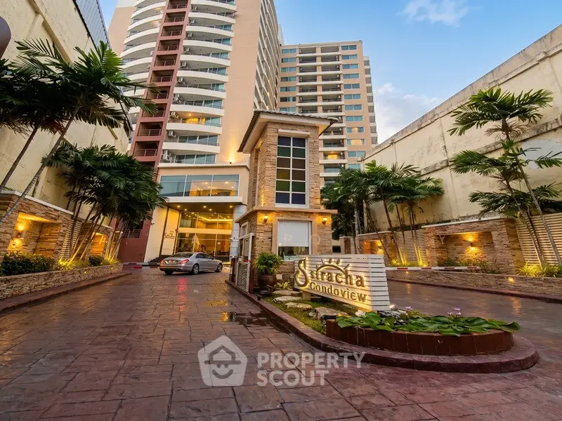 Stunning condo entrance with lush landscaping and modern architecture, perfect for urban living.