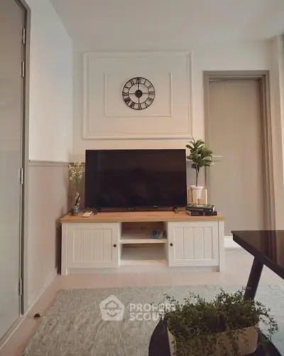 Stylish living room with modern decor and wall-mounted clock